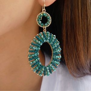 Beautiful rhinestones dangle earrings by “Noir”